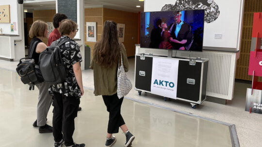 people watching a screen