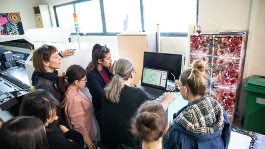people watching a screen