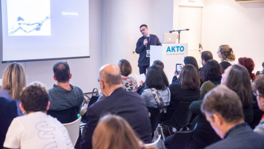 a man speaking on the microphone
