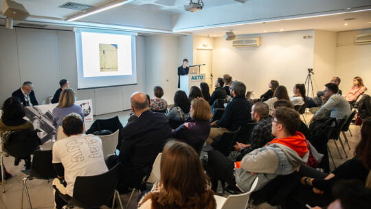 a woman speaking on the microphone