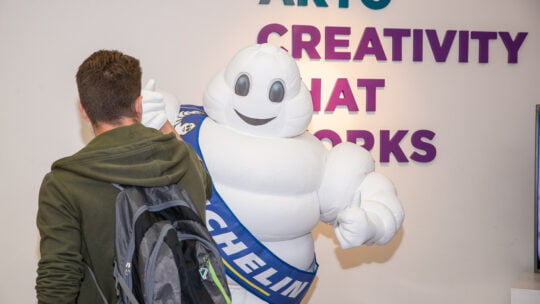 man with a mascot