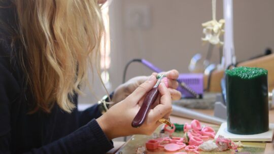 woman making jewlery
