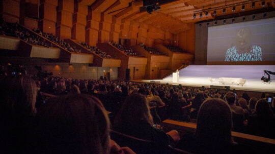 woman speaking to her audience